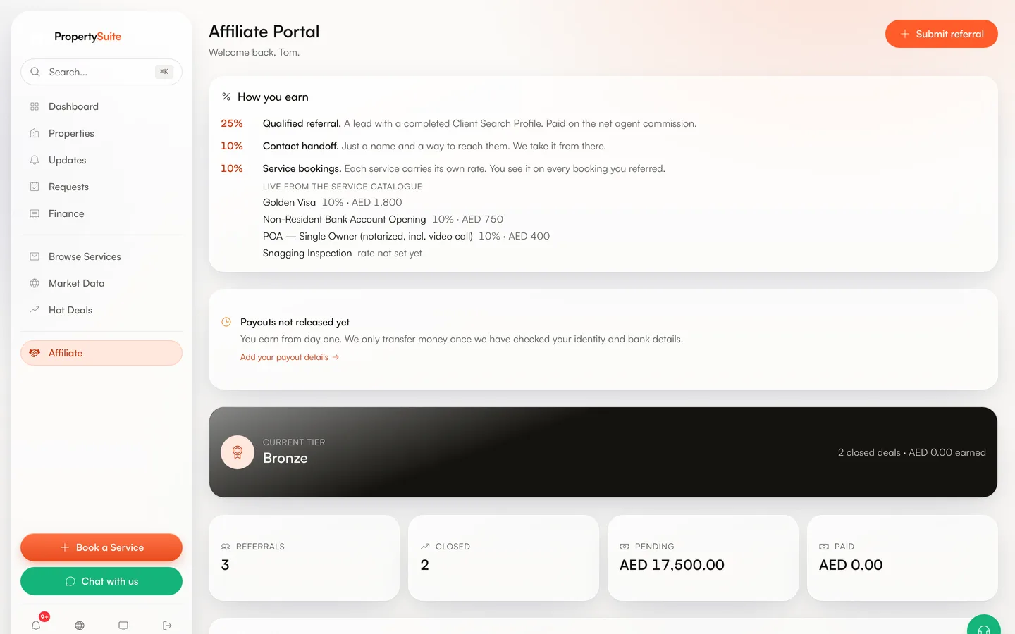 The affiliate dashboard of a test account: a How-you-earn card with 25% for qualified referrals, 10% for contact handoffs and the current rates from the service catalogue, including one service whose rate is explicitly not set yet; a notice that payouts are only released once identity and bank details are checked; the current tier; and counters for referrals, closed deals and pending earnings.